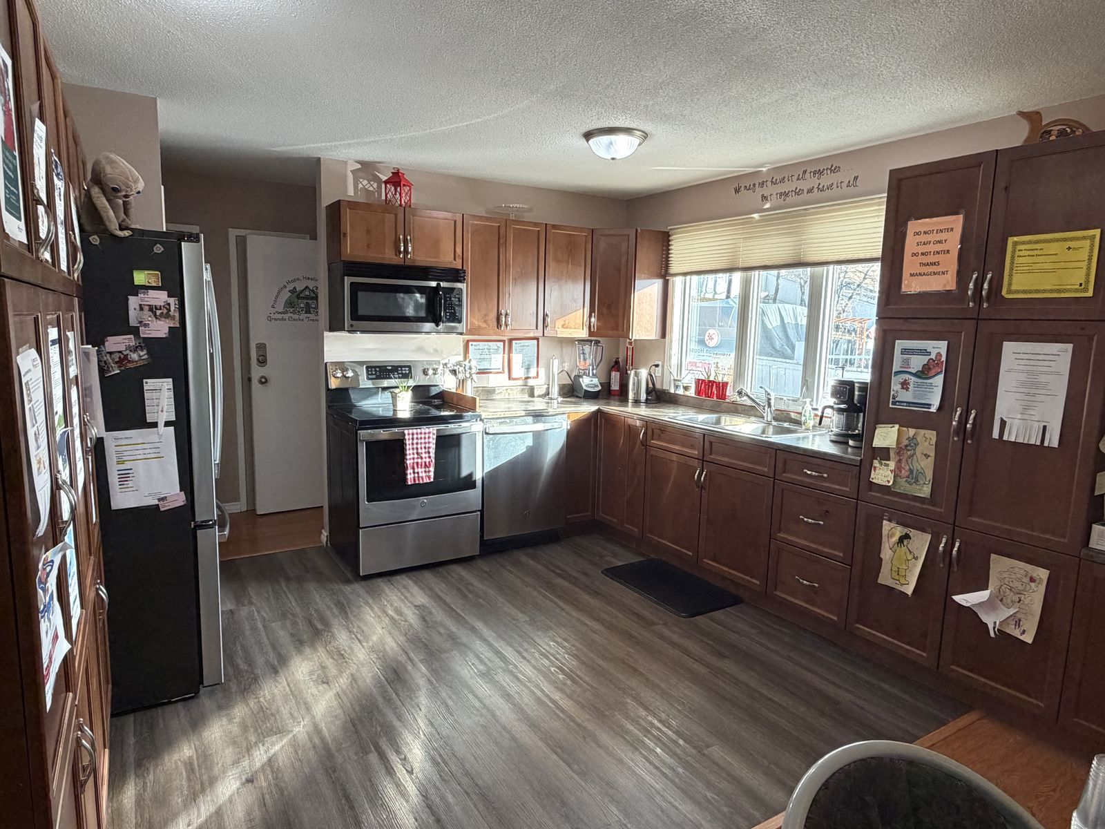 a warm, homey kitchen with personal touches, a real welcoming space, no people