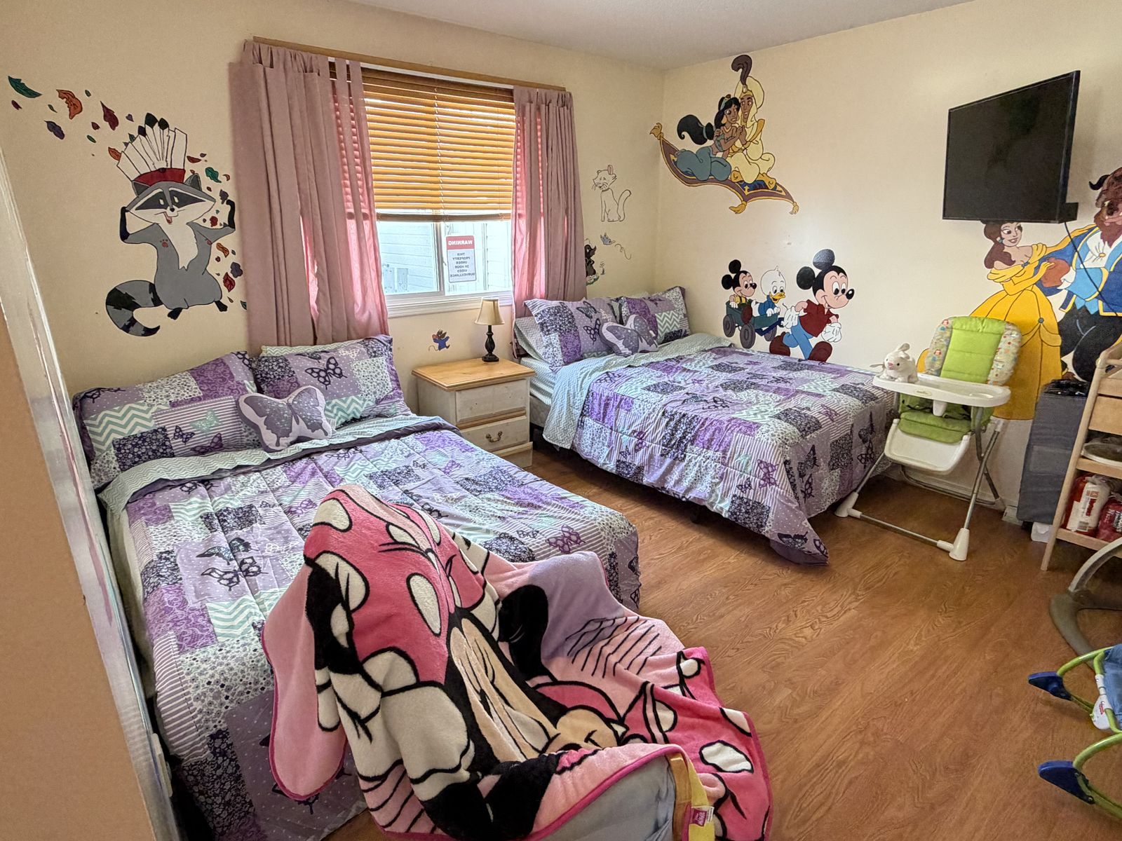 a bright and cheerful child's room with colourful bedding and a calm welcoming atmosphere, no people shown
