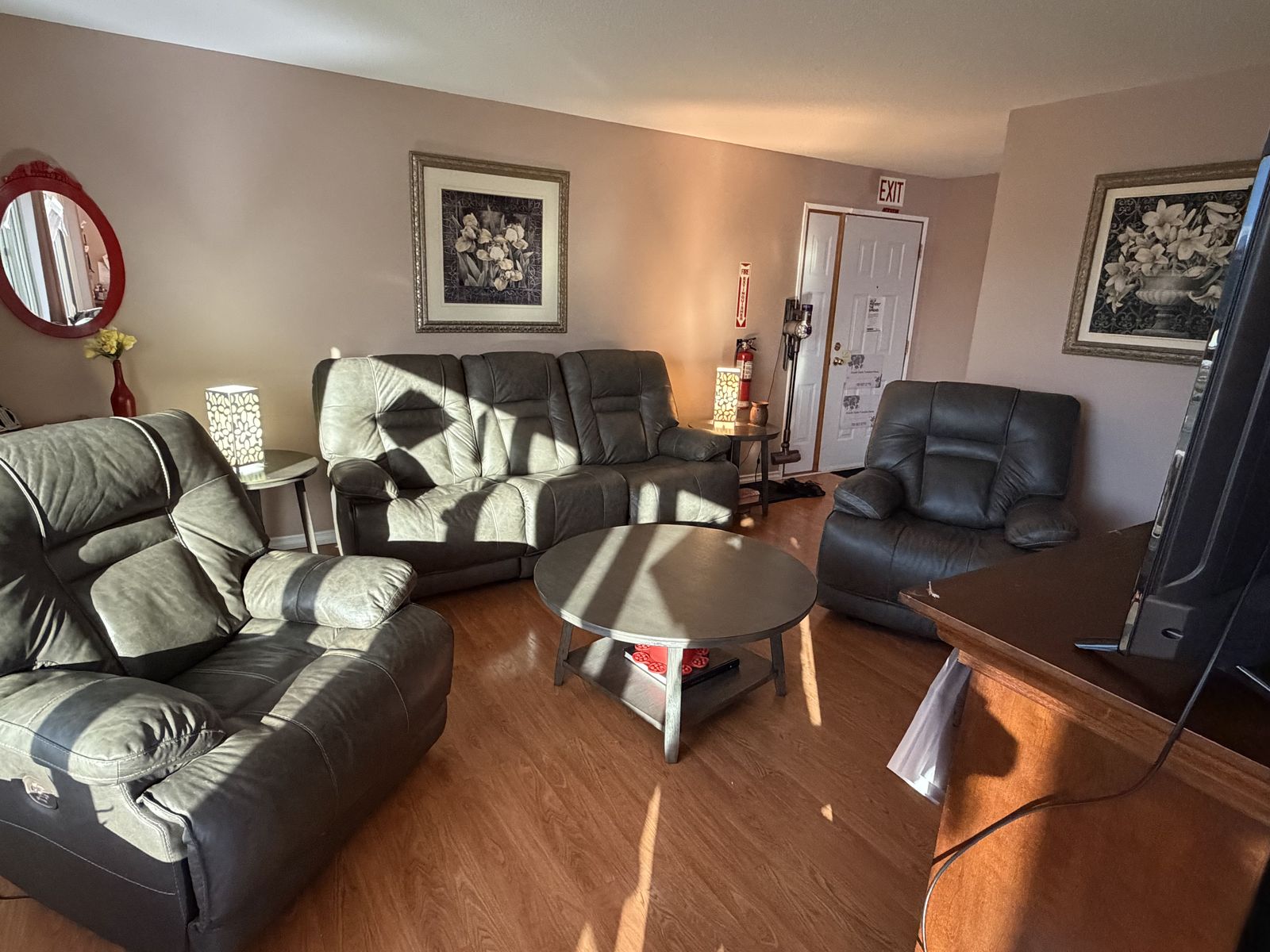 A warm, lived-in living room with soft seating and natural light. A calm, welcoming space.